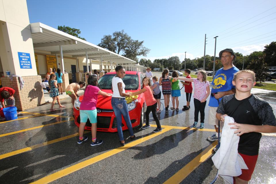 Ward-Highlands Elementary has been a southeast Ocala mainstay for decades. This 2015 file photo shows fifth grade students washing cars in the school parking lot during the eighth annual United Way Car Wash.