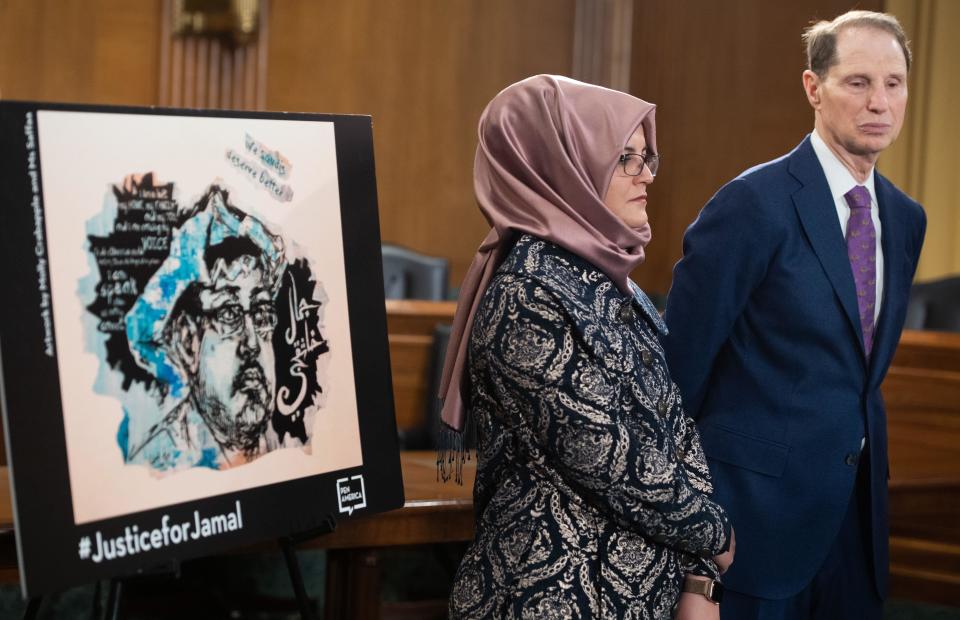Hatice Cengiz, slain Washington Post columnist Jamal Khashoggi's fiancée, stands alongside Senator Ron Wyden, Democrat of Oregon during a press conference on Capitol Hill on March 3, 2020. / Credit: SAUL LOEB/AFP/Getty