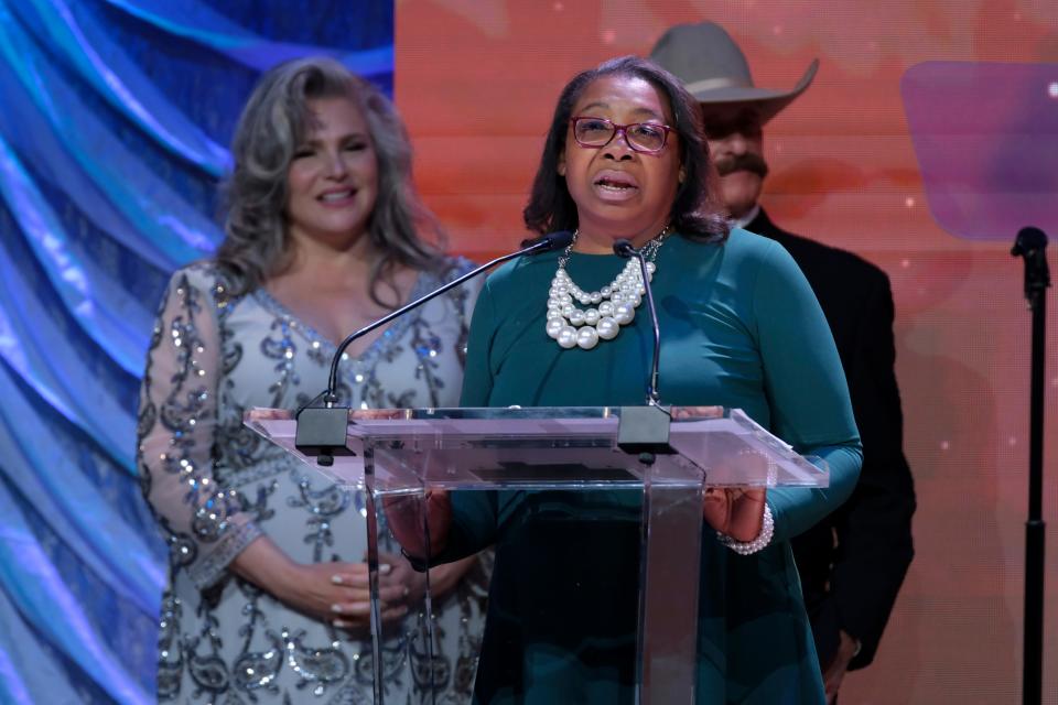 Daphne Fowler accepts the 2023 Hall of Great Westerners award on behalf of Daniel Webster "80 John" Wallace during the 2023 Western Heritage Awards at the National Cowboy & Western Heritage Museum in Oklahoma City, Saturday, April 15, 2023. 