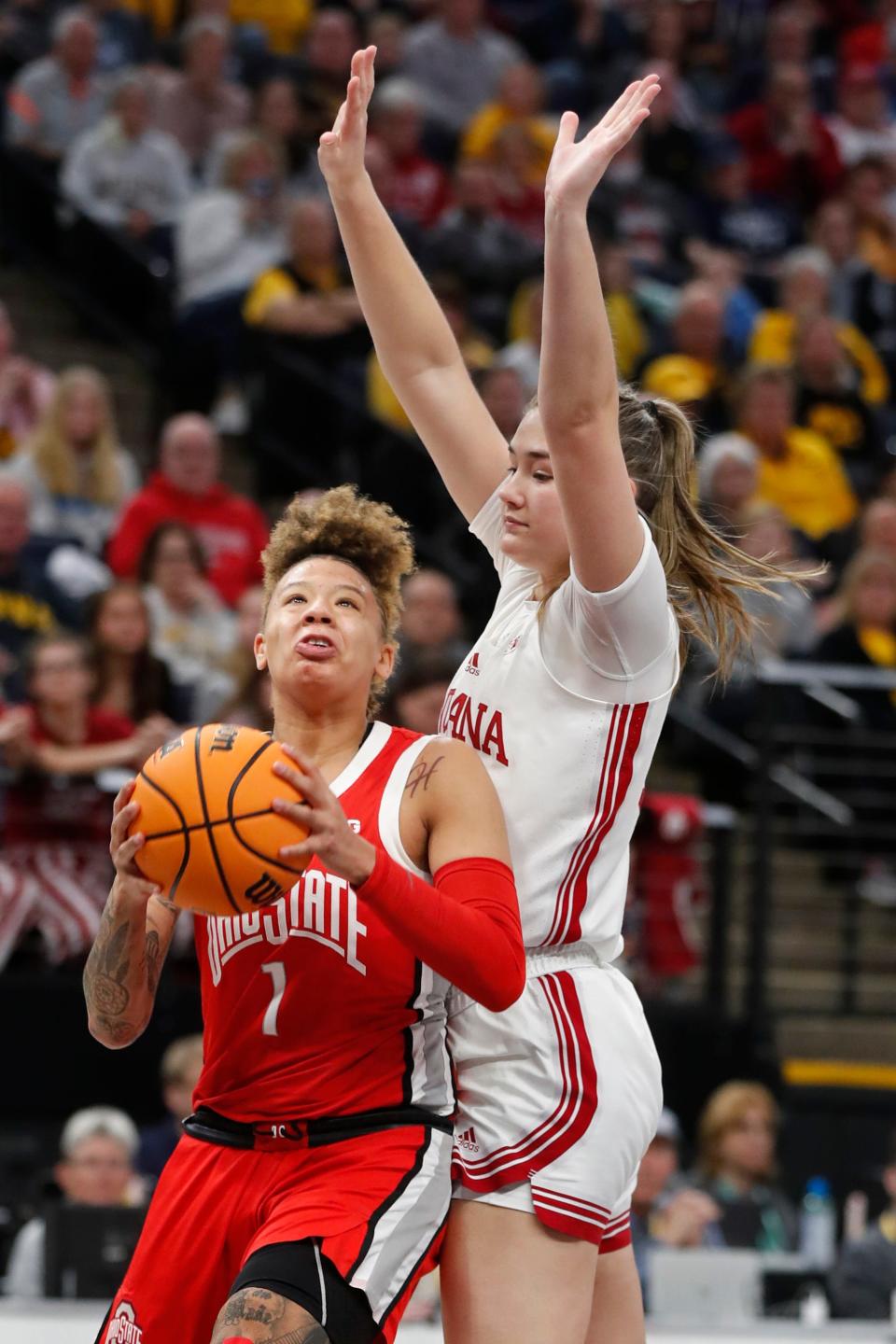 Ohio State guard Rikki Harris goes to the basket around Indiana's Lilly Meister.