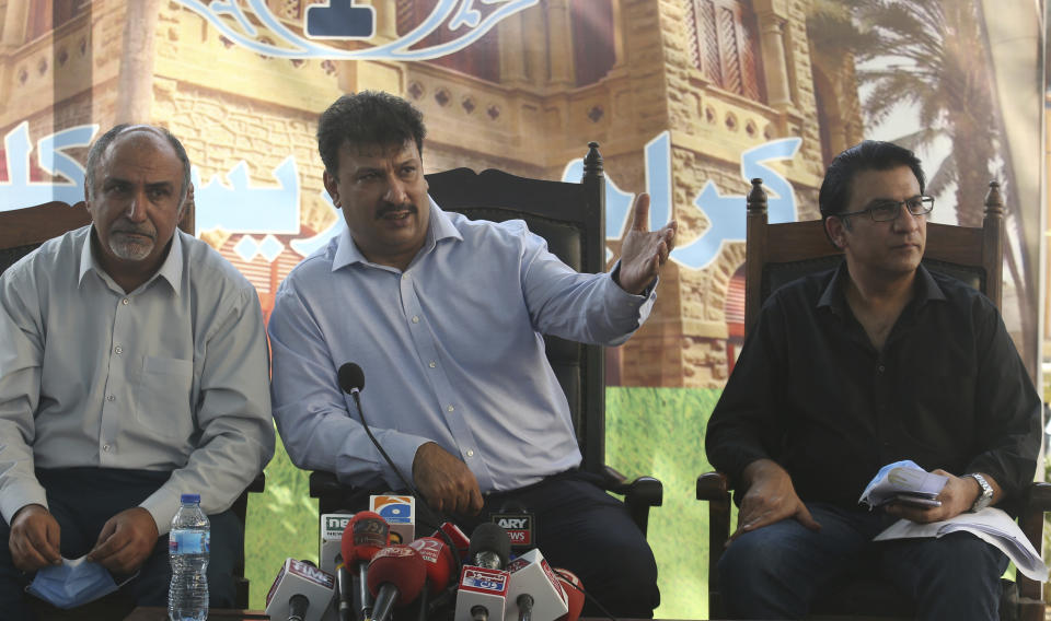 Captain Chaudhry Salman, center, President of Pakistan Airlines Pilots' Association addresses a news conference with others in Karachi, Pakistan, Saturday, June 27, 2020. A union of Pakistani pilots on Saturday fired back at the country's aviation minister, who claims as many as 262 pilots serving at state-run Pakistan International airlines and other airline companies, obtained licenses to fly planes by having others take exams for them.(AP Photo/Fareed Khan)