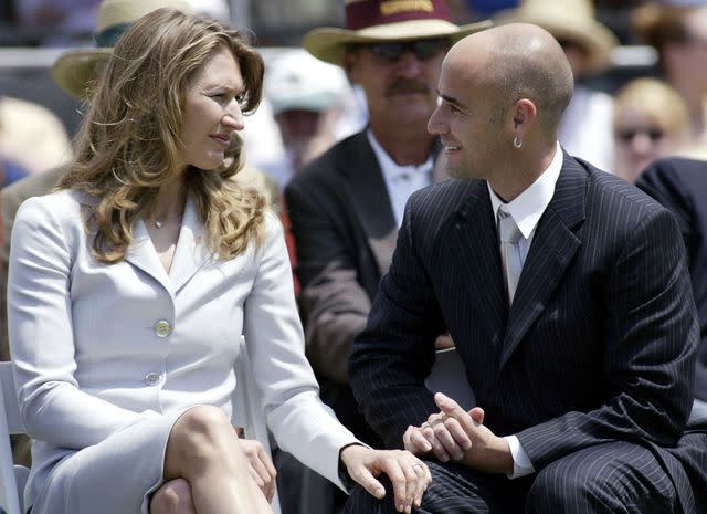 <p>Joe Giblin/WireImage</p> Steffi Graf and Andre Agassi during the the Class of 2004 induction ceremony at the International Tennis Hall of Fame