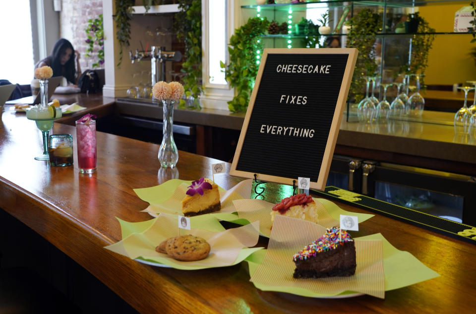 Cheesecake and cookie dessert items are displayed on the bar at the Golden Girls Kitchen pop-up restaurant, Monday, July 25, 2022, in Beverly Hills, Calif. The pop-up only has reservations through the end of October. But there are plans to take it on the road to New York, Chicago, San Francisco and Miami. (AP Photo/Chris Pizzello)