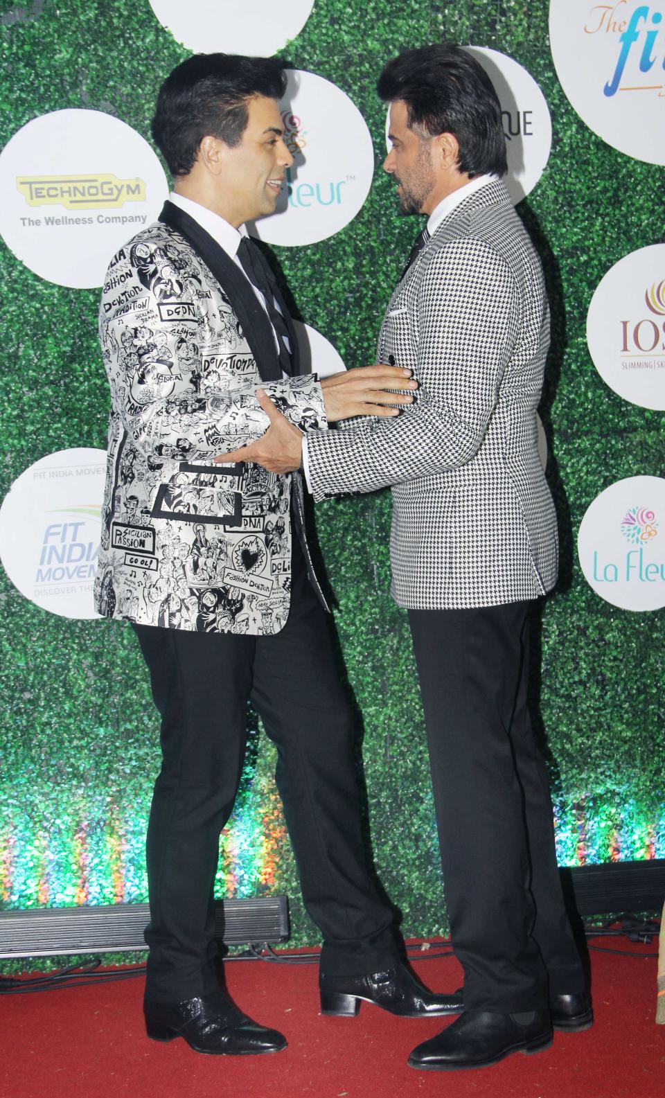 Karan Johar and Anil Kapoor engrossed in a conversation.