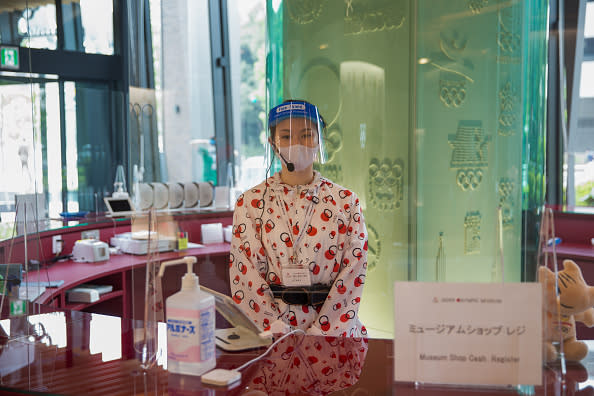 Staff at the Japan Olympic Museum with protective gear as a precaution against the spread of the coronavirus. 