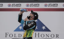 Kevin Harvick celebrates after winning a NASCAR Cup Series auto race at Atlanta Motor Speedway, Sunday, June 7, 2020, in Hampton, Ga. (AP Photo/Brynn Anderson)