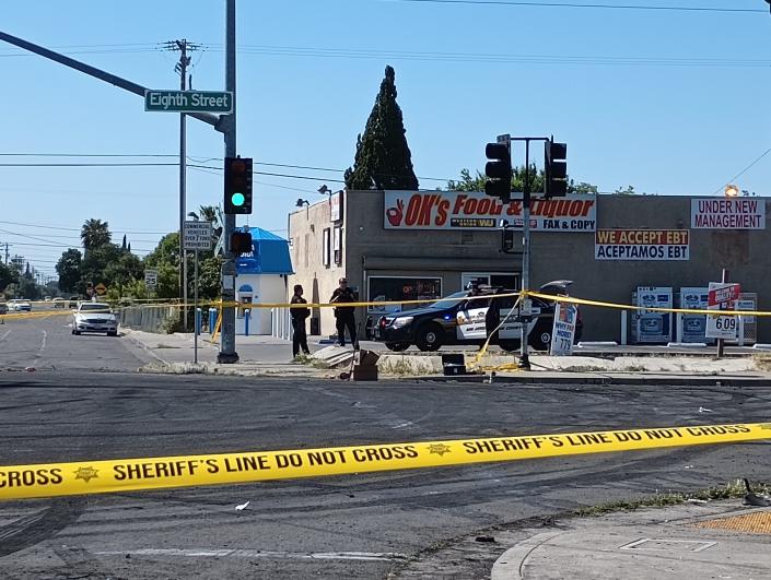 Sheriff's Office investigators near the scene of a reported homicide at Eighth Street and B Street in Stockton on May 22, 2023.