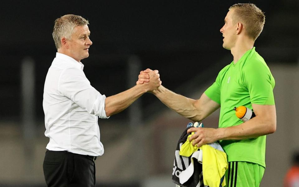 Manchester United's manager Ole Gunnar Solskjaer, left, greets with Copenhagen's goalkeeper Karl-Johan Johnsson - Reuters