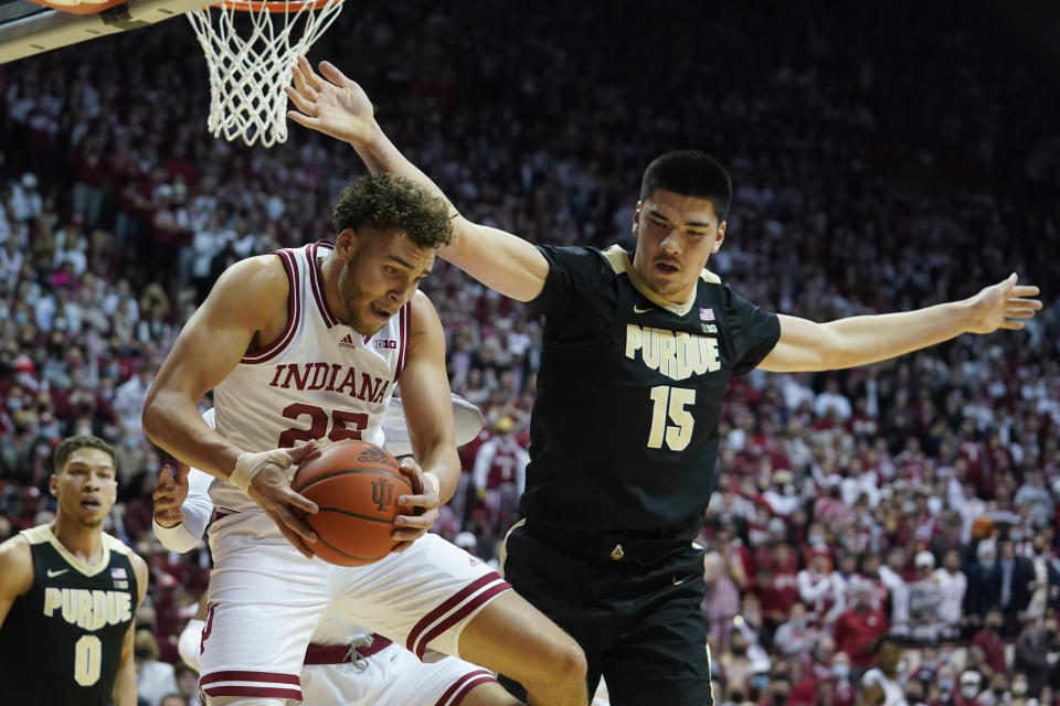 Indiana's Race Thompson (25) grabs a rebound from Purdue's Zach Edey (15) during the first half of an NCAA college basketball game, Thursday, Jan. 20, 2022, in Bloomington, Ind. (Darron Cummings)