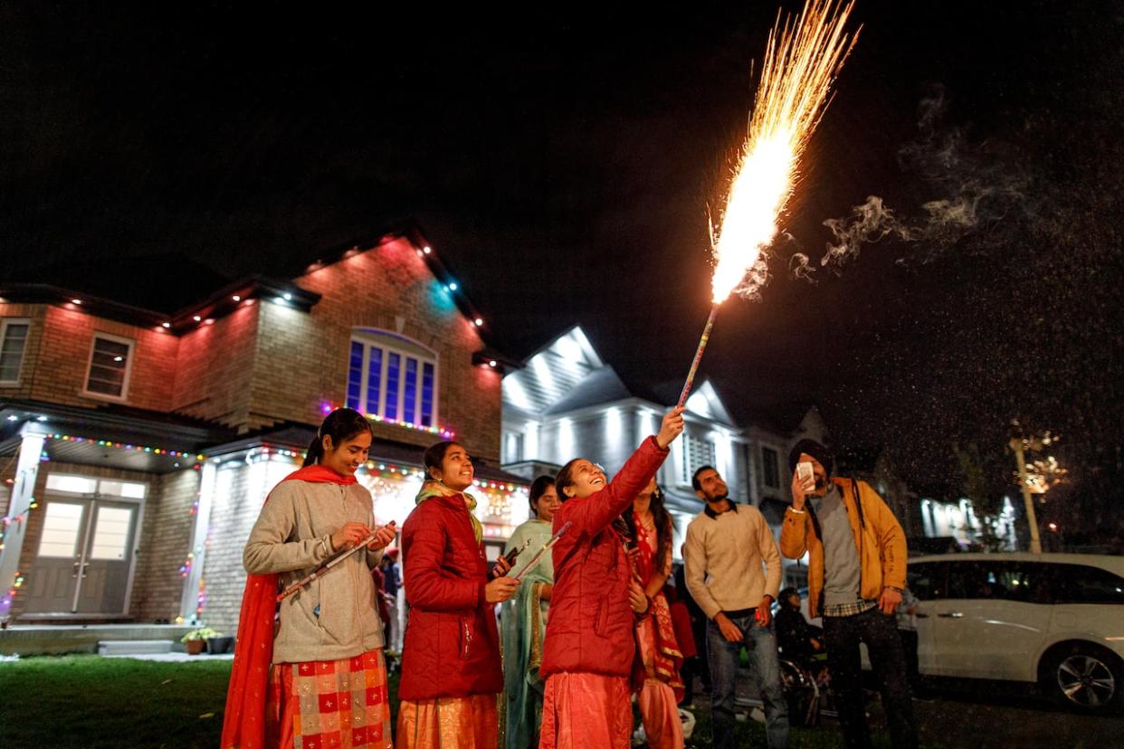 Residents of Brampton, Ont., set off fireworks to mark the start of Diwali on Nov. 4, 2021. Saskatoon is considering adding Diwali and the Lunar New Year as dates when permit-free fireworks are allowed in the city. (Evan Mitsui/CBC - image credit)