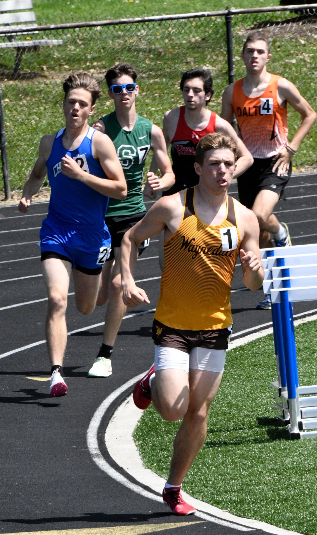 Waynedale's JJ Varner leads the pack on the first lap of the boys 1,600 meter run on his way to winning the event.
