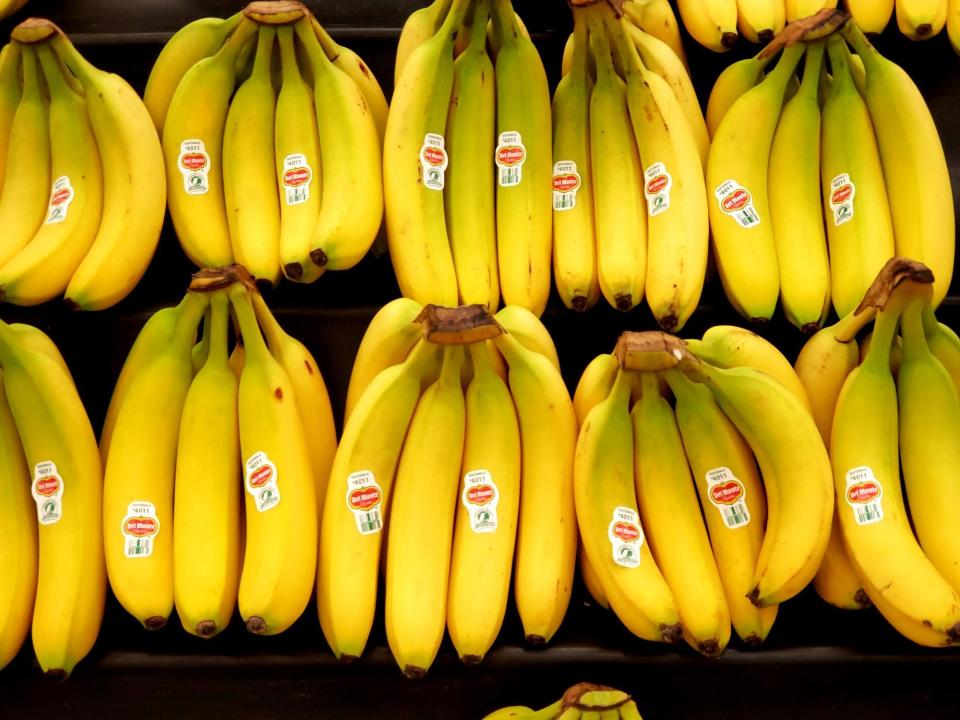 Wrap the tops of bananas with plastic wrap