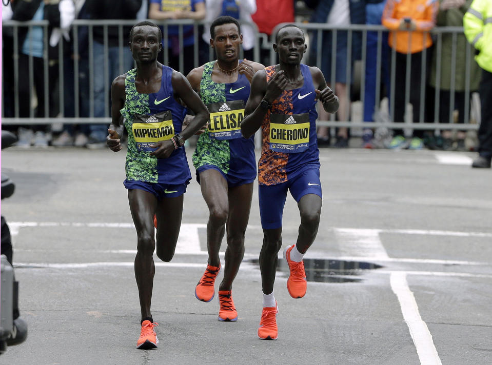 Kenneth Kipkemoi, left, of Kenya, Lelisa Desisa, center, of Ethiopia, and Lawrence Cherono, right, of Kenya, compete in the final mile of the 123rd Boston Marathon on Monday, April 15, 2019, in Boston. (AP Photo/Steven Senne)