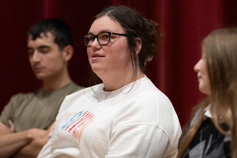 Recent Harlan County High School graduate Jacey Collins, center, is photographed at the school in Harlan, Ky., on Wednesday, May 8, 2024.