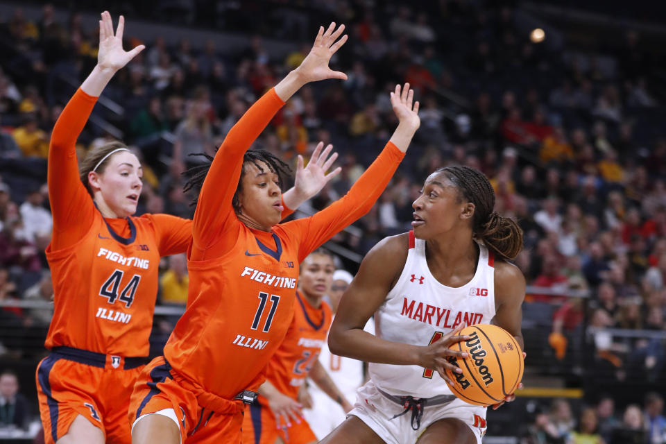 Illinois forward Kendall Bostic (44) and guard Jada Peebles (11) defend against Maryland guard Diamond Miller during the first half of an NCAA college basketball game at the Big Ten women's tournament Friday, March 3, 2023, in Minneapolis. (AP Photo/Bruce Kluckhohn)