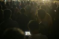 A man watching a live stream of the PAP rally. (Photo: Joseph Nair)