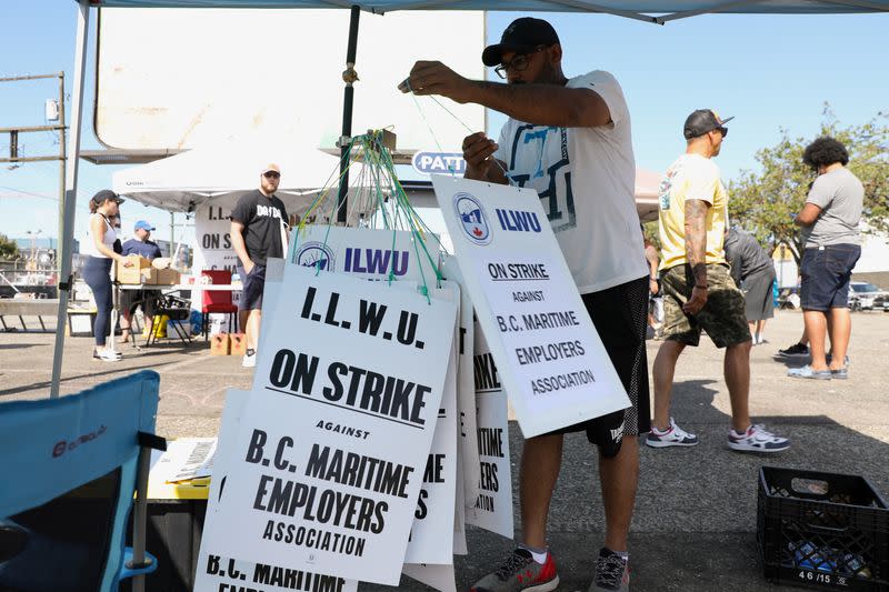 Union members with the International Longshore and Warehouse Union Canada (ILWU) gather in Vancouver