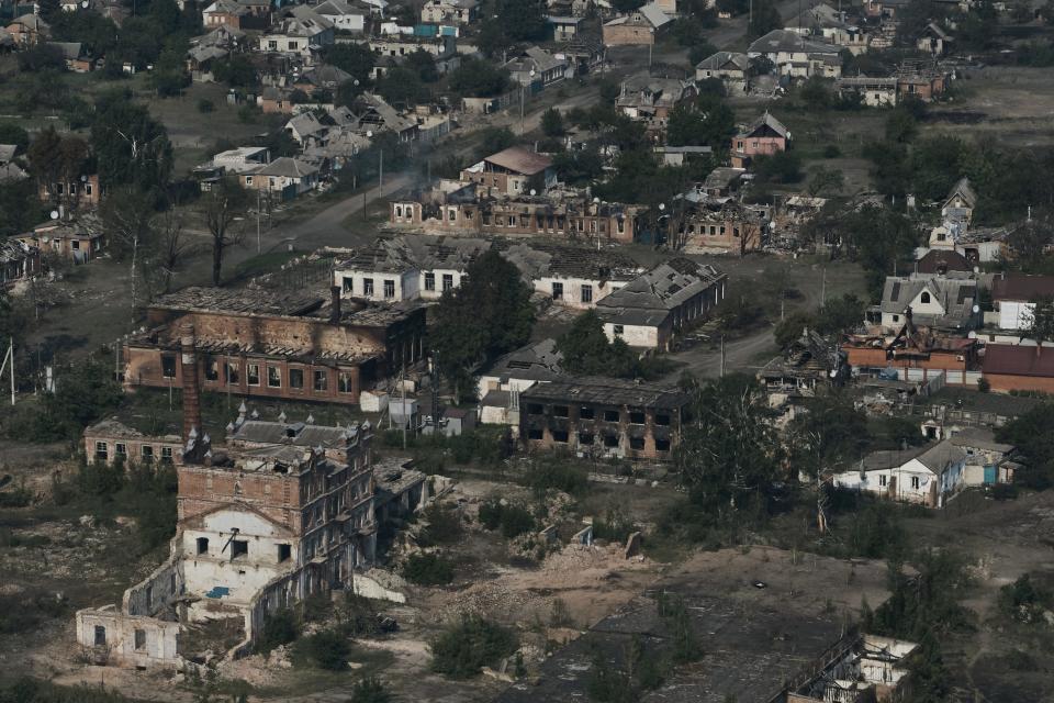 In this aerial view, heavily damaged buildings stand in the Ukrainian boarder city of Vovchansk, in the Kharkiv region, on May 20, 2024.