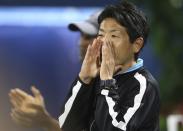 Masashi Yoshikawa, Japan Tennis Association coach, shouts as he watches the match between Japan's Naomi Osaka and Kristina Mladenovic, of France, during the Dubai Duty Free Tennis Championship in Dubai, United Arab Emirates, Tuesday, Feb. 19, 2019. (AP Photo/Kamran Jebreili)