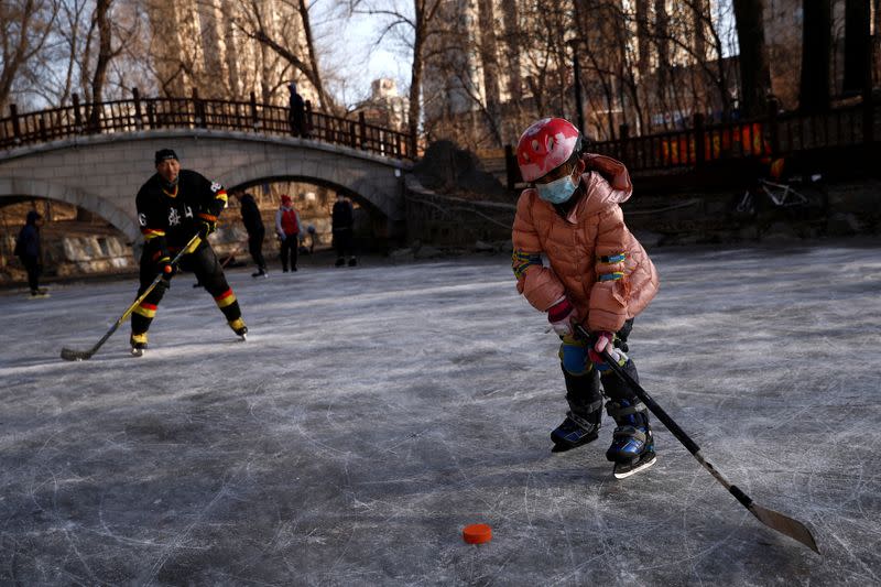 The Wider Image: On a frozen pond far from the Olympics, meet China's ice hockey veterans