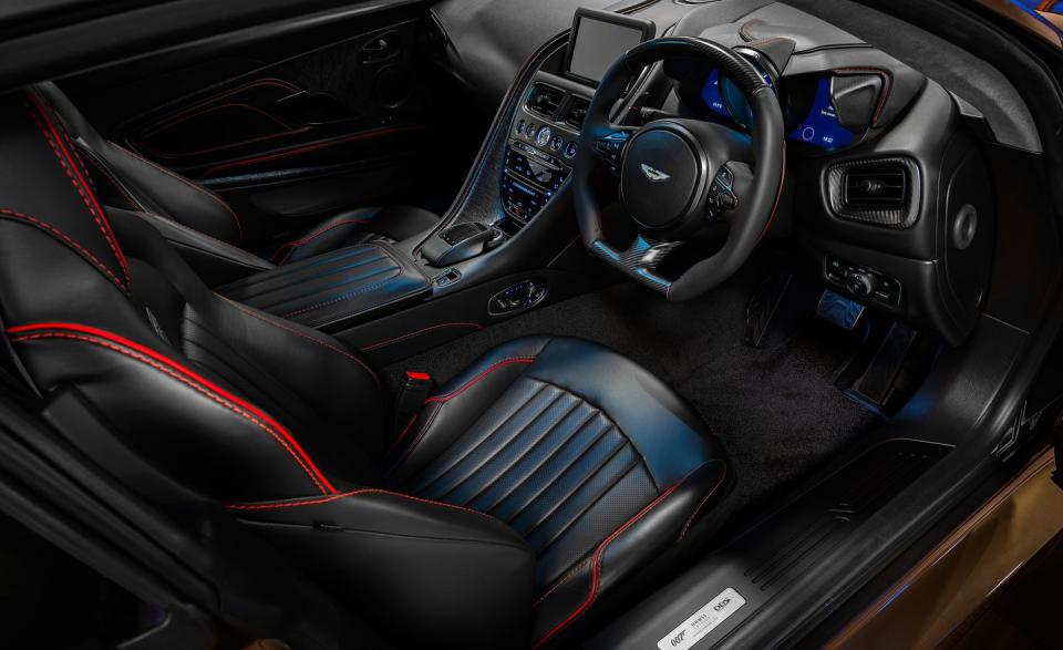 <p>The interior is trimmed in black leather with red stitching.</p>
