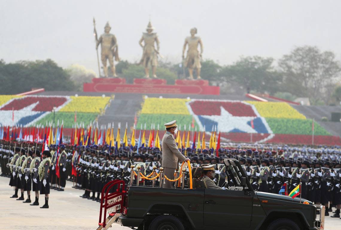 Senior Gen. Min Aung Hlaing, head of the military council, inspects officers during a parade to commemorate Myanmar’s 77th Armed Forces Day in Naypyitaw, Myanmar, Sunday, March 27, 2022. The occasion commemorates resistance against Japanese occupiers during World War II, and is a show of strength as the military battles armed resistance to its takeover last year that ousted the elected government of Aung San Suu Kyi. (AP Photo/Aung Shine Oo)