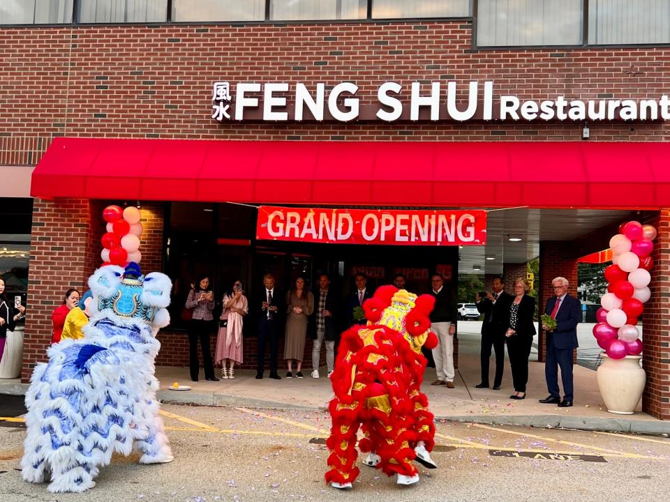 Colorful "lion dancers" added a festive flair to the opening of Feng Shui during its grand opening Oct. 17.