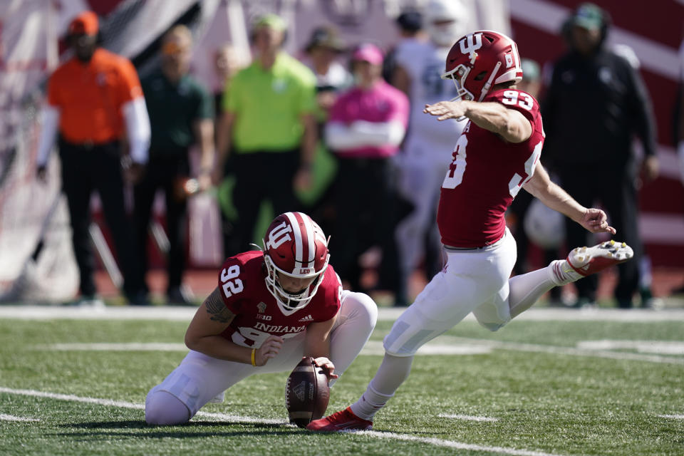 Indiana place kicker Charles Campbell (93) kicks a field goal out of the hold of Chase Wyatt (92) during the first half of an NCAA college football game against Michigan State, Saturday, Oct. 16, 2021, in Bloomington, Ind. (AP Photo/Darron Cummings)