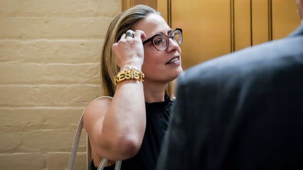 PHOTO: Sen. Kyrsten Sinema walks to a vote at the Capitol in Washington, July 28, 2022. (Drew Angerer/Getty Images)