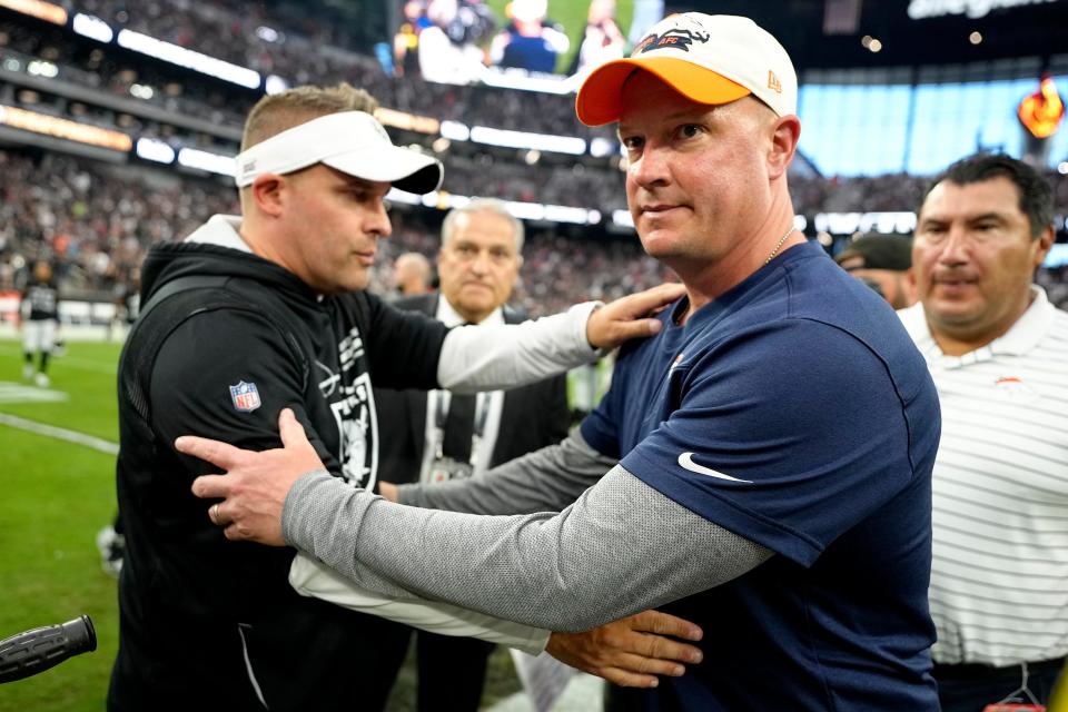 Raiders Josh McDaniels, left, and Broncos counterpart Nathaniel Hackett will square off Sunday in Denver in what could be a key game for both of them.