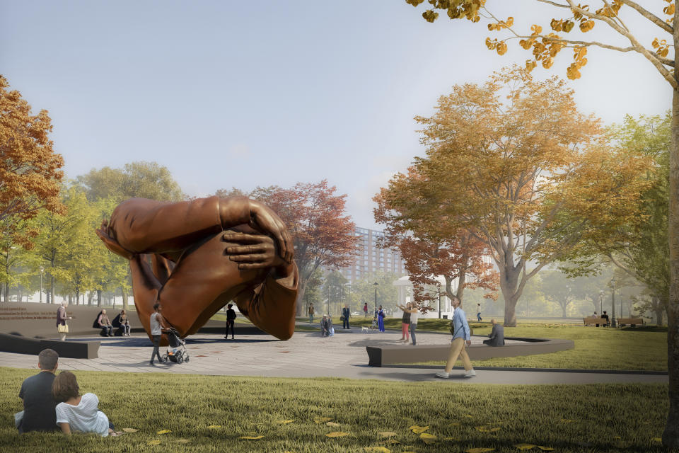 This computer rendering provided by Mass Design Group, shows a memorial to Dr. Martin Luther King Jr. and Coretta Scott King, a 20-foot-high (6-meter-high) bronze sculpture called “The Embrace", planned for the Boston Common in Boston. The memorial has received unanimous approval from a city panel, allowing construction to start, the group behind the memorial said Wednesday, May 26, 2021. (Mass Design Group via AP)