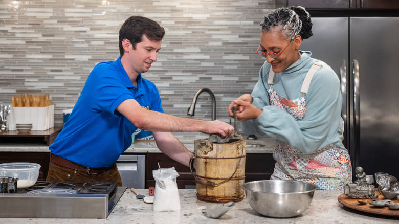 Carla Hall making ice cream with man