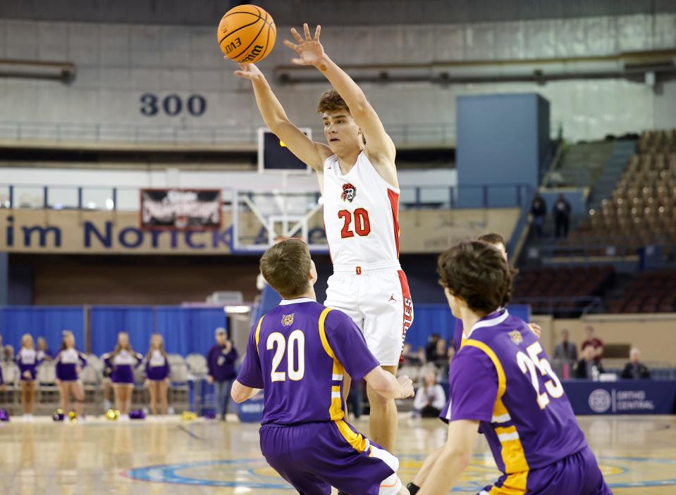 Dale's Casen Richardson passes the ball over Wister's Riley Crane during a Class 2A state tournament quarterfinal game at State Fair Arena on Tuesday.