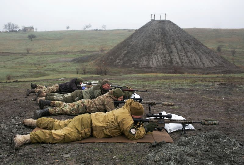 Snipers of the Ukrainian armed forces aim their rifles during training in Donetsk region