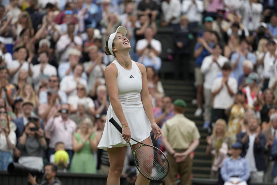 Ukraine's Elina Svitolina celebrates after beating Poland's Iga Swiatek to win their women's singles match on day nine of the Wimbledon tennis championships in London, Tuesday, July 11, 2023. (AP Photo/Kirsty Wigglesworth)