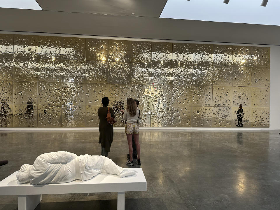 A marble fountain by Italian artist Maurizio Cattelan portraying a slouching man urinating is displayed at Gagosian gallery on May 23, 2024, in New York as part of the artist's "Sunday" visual installation. (AP Photo/Jocelyn Noveck)