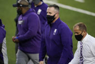 Northwestern head coach Pat Fitzgerald, center, walks off the field after a 21-20 victory over Iowa in an NCAA college football game, Saturday, Oct. 31, 2020, in Iowa City, Iowa. (AP Photo/Charlie Neibergall)