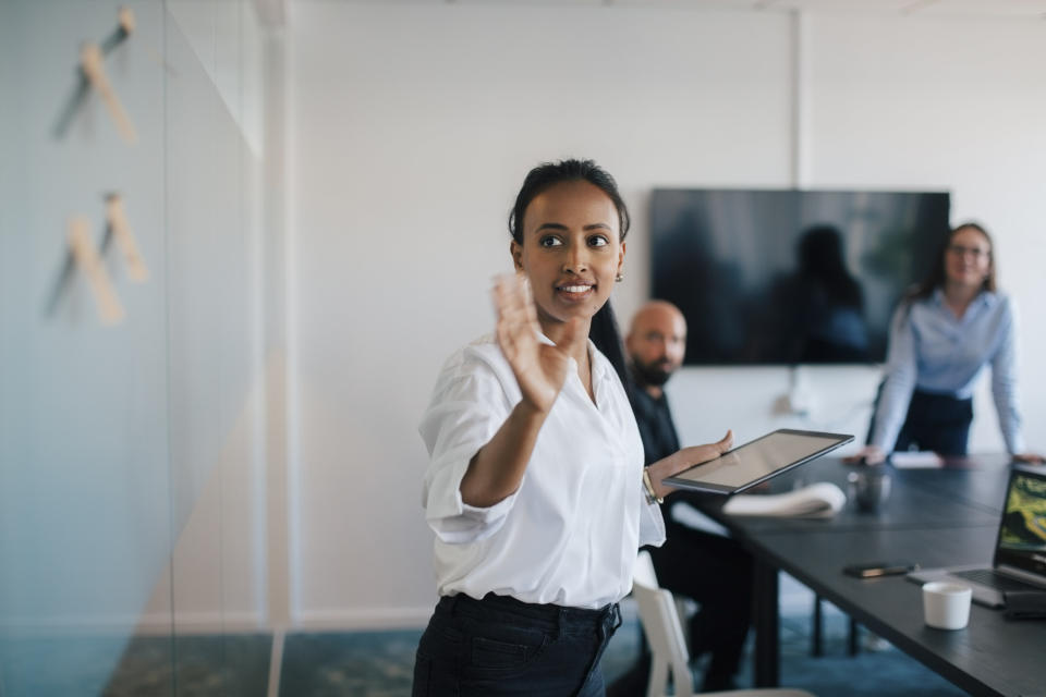 woman giving a presentation at work