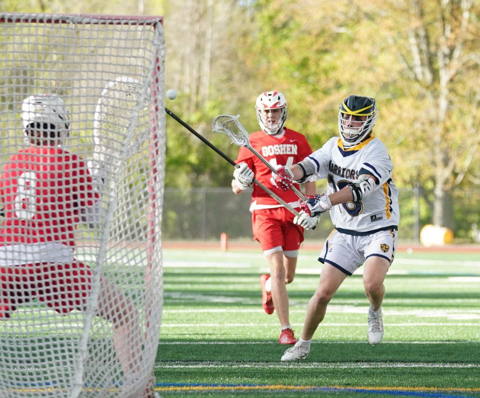 Lourdes' Drew Cornax (18) takes a shot on goal during their 16-15 win over Goshen in boys lacrosse action at Our Lady of Lourdes High School in Poughkeepsie on Friday, May 5, 2023.