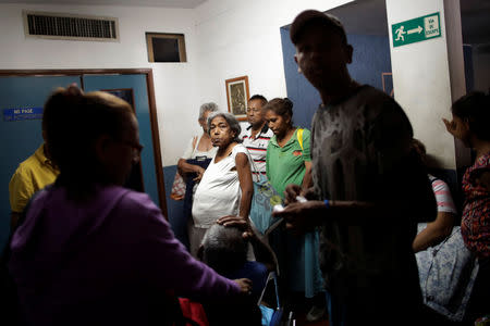 FILE PHOTO: Patients with kidney disease wait with their relatives for a dialysis session at a dialysis centre after a blackout in Maracaibo, Venezuela April 13, 2019. REUTERS/Ueslei Marcelino