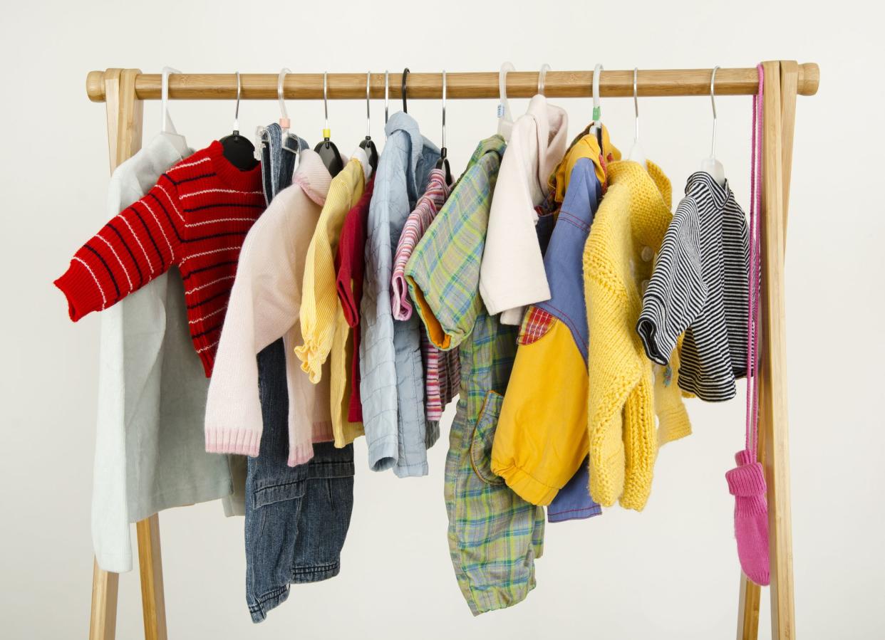 Colorful wardrobe of newborn,kids, babies full of all clothes, accessories.