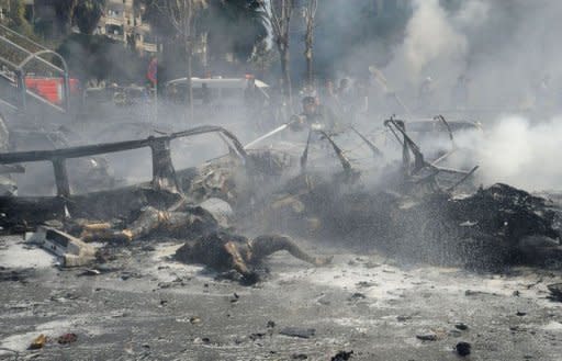 Imagen distribuida por la agencia SANA este 21 de febrero 2013 que muestra cuerpos de víctimas de la explosión.
