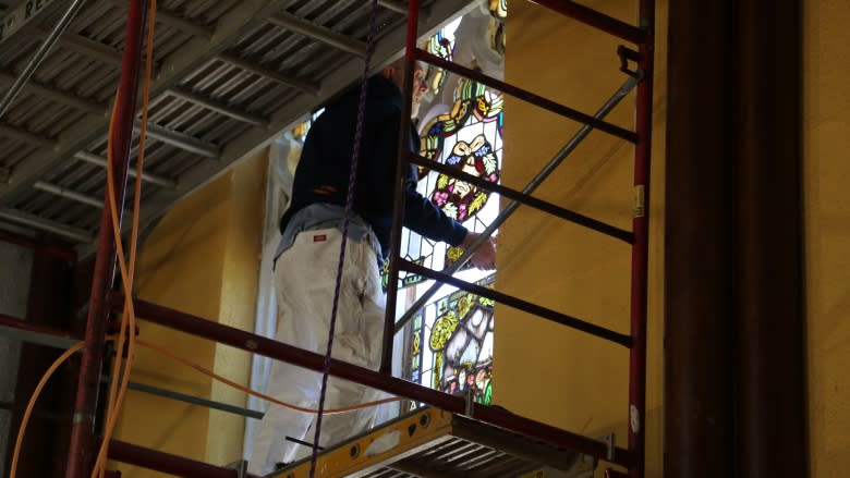 The final piece of the stained glass puzzle in place at UNB