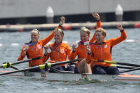 Silver medalists Ellen Hogerwerf, Karolien Florijn, Ymkje Clevering and Veronique Meester of Netherlands pose for photographers after a medal ceremony for the women's rowing four final at the 2020 Summer Olympics, Wednesday, July 28, 2021, in Tokyo, Japan. (AP Photo/Lee Jin-man)