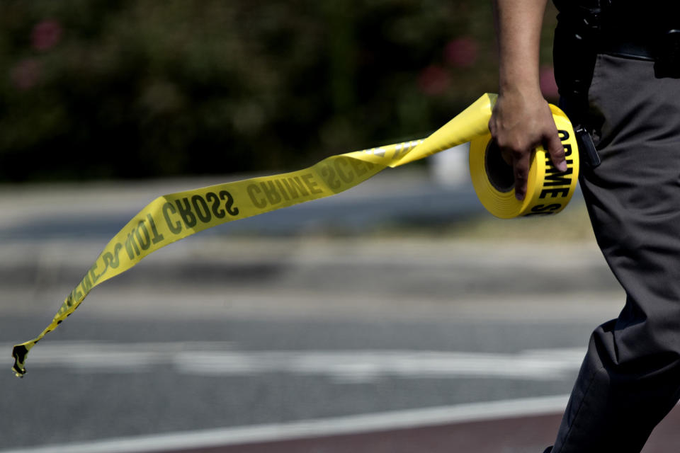 <p>A police office carries crime scene tape near the Eugene Simpson Stadium Park in Alexandria, Virginia, U.S., on Wednesday, June 14, 2017. (Photo: Andrew Harrer/Bloomberg via Getty Images) </p>