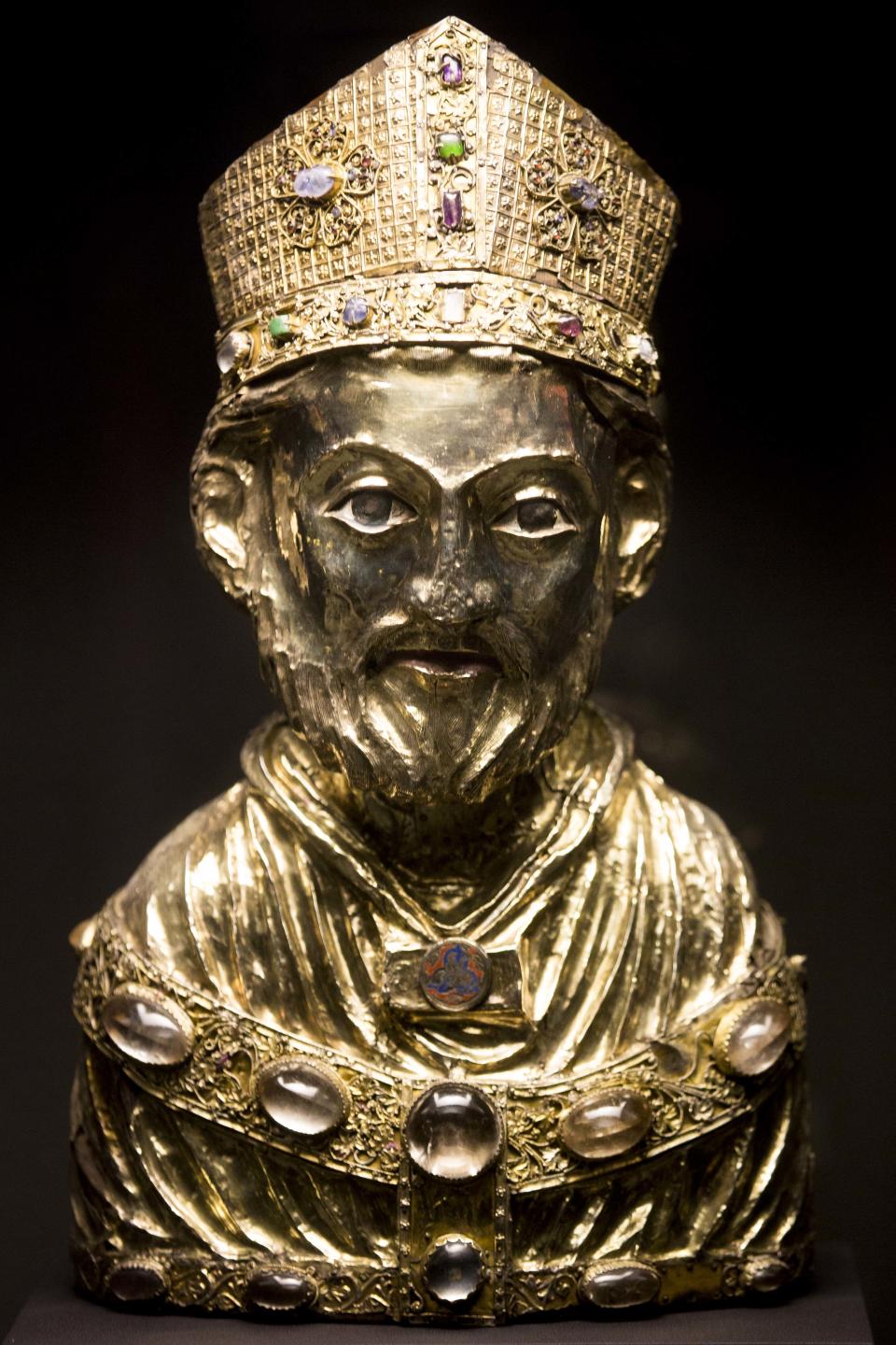 In this picture taken Jan. 9, 2014 a medieval reliquary bust of St. Blaise, of the Welfenschatz, is displayed at the Bode Museum in Berlin. One of Germany’s most precious collections of medieval Christian art is at the center of a complicated ownership dispute between the foundation that oversees the Berlin museums and the heirs of Jewish art dealers who claim their ancestors had to sell the objects to the Nazis under pressure in 1935. For years, both sides have claimed they’re the legitimate owners, arguing their cases without finding a successful solution, so on Wednesday Jan 15, 2014 , in a highly anticipated meeting, a German government-created commission will come together to make a recommendation on who should rightfully own the so-called Welfenschatz -or Guelph Treasure. (AP Photo/Markus Schreiber)