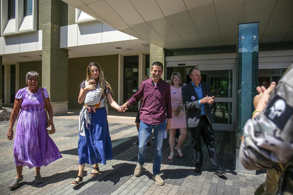 Image: Michigan gubernatorial candidate Ryan Kelly exits the U.S. District Court in Grand Rapids, Mich., with his family and supporters on Thursday, June 9, 2022. Kelley has been charged with four misdemeanors from his involvement with the riot at the Capitol Building, on Jan. 6, 2021. (Daniel Shular / The Grand Rapids Press via AP)