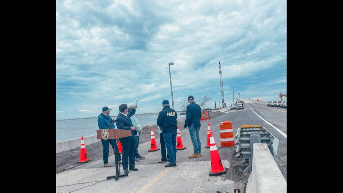 Kevin Guthrie, director of the Florida Division of Emergency Management, posted an image to Twitter of state officials, including Gov. Ron DeSantis, on the soon-to-open Sanibel Causeway on Oct. 19, 2022. The bridge, damaged by Hurricane Ian on Sept. 28, opened to emergency crews a week earlier and to the public at 11 a.m. Oct. 19.