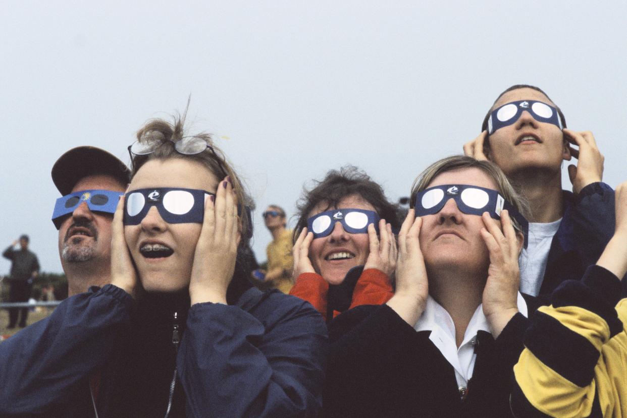 1999: People view a solar eclipse in Vauville, France. 