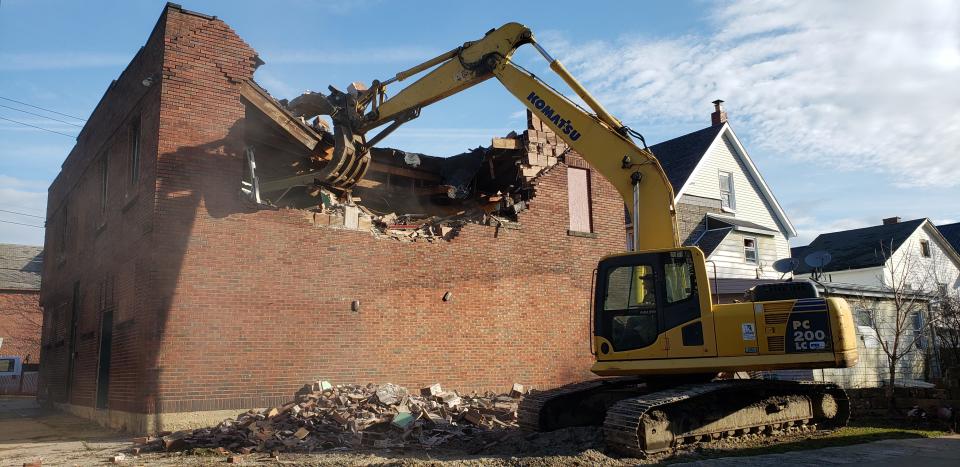 Demolition crews from K.C. Transportation Inc. of Waterford began tearing down the former Scotty’s Cigar & Martini Lounge at 301 German St. on Tuesday morning. The Bayfront East Side Taskforce, which owns the property, plans to create a neighborhood green space there.